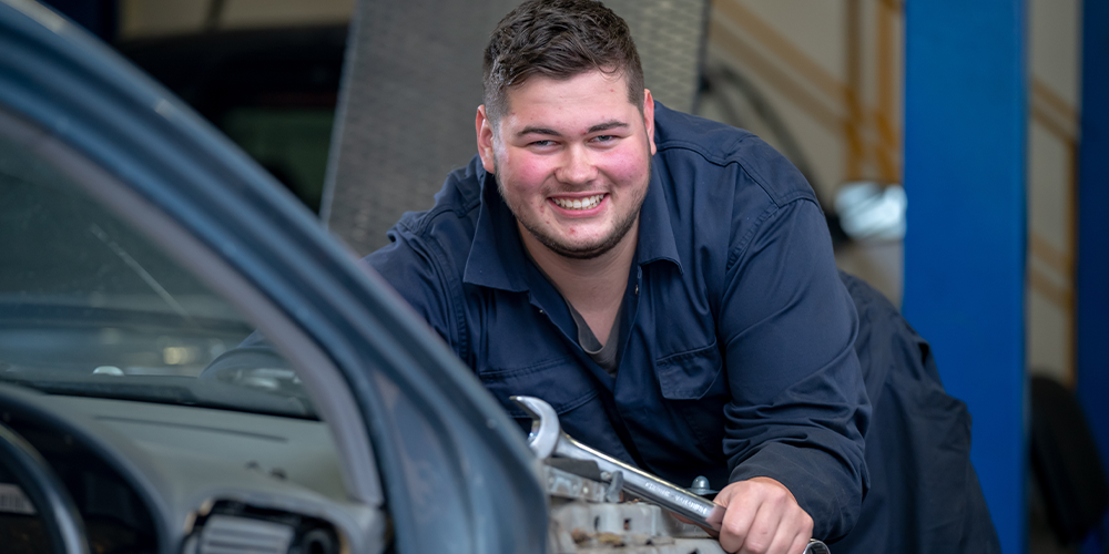 Automotive learner working under a car bonet